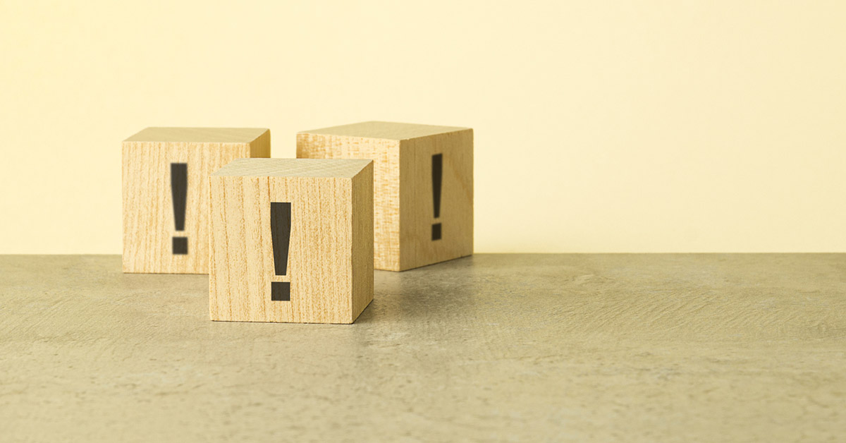 Image of wooden blocks arranged to symbolize precautions or warnings