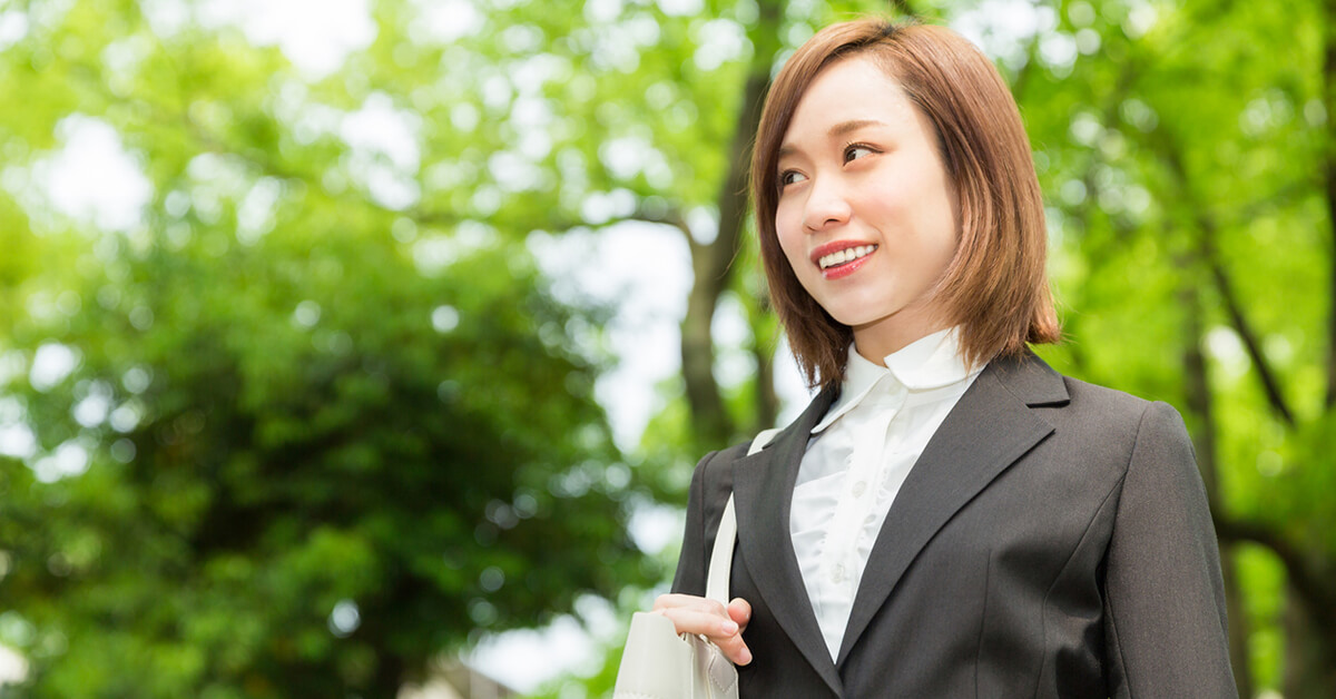 Smiling Businesswoman Wearing A Suit Outside