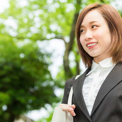 Smiling Businesswoman Wearing A Suit Outside
